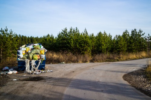 Lockable skip being loaded with construction waste