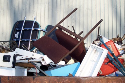 Business professionals loading waste into a skip