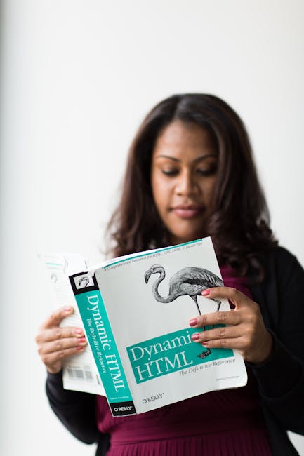 Three large black and white trash bags made of plastic or thick material, filled with household rubbish, are placed on the side of a paved street near a curb. One bag is partially leaning against a pa